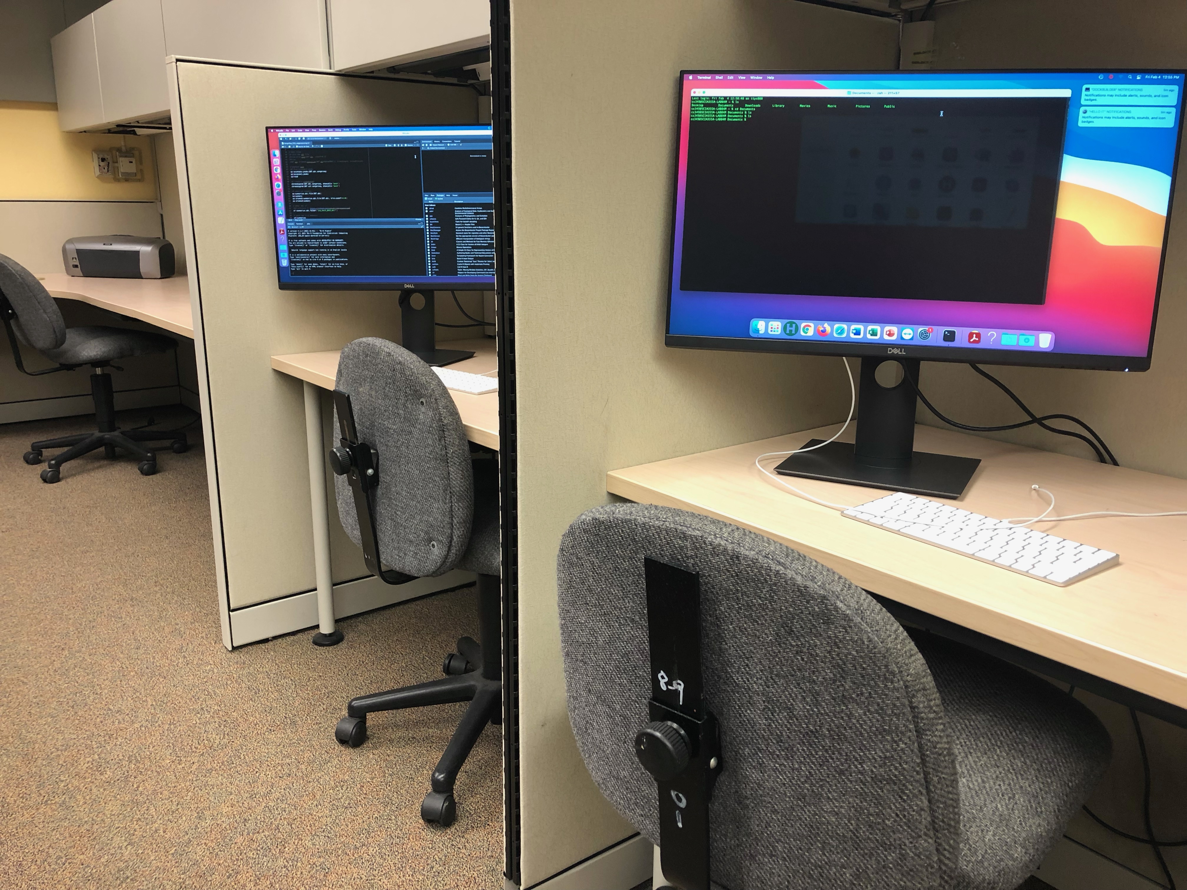 Image of new computational work stations, computers and chairs